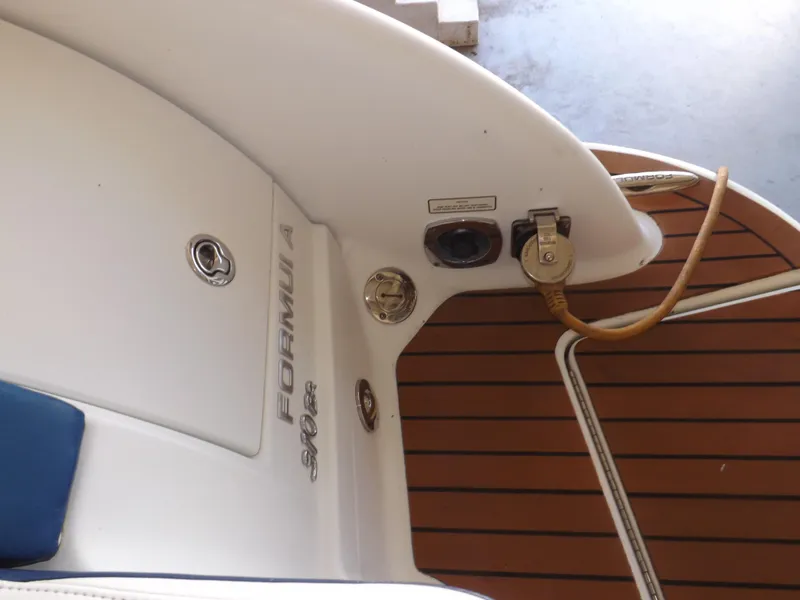 Slide: The Image of 2008 Formula 310 Bowrider boat deck with power connections and logo. - 7