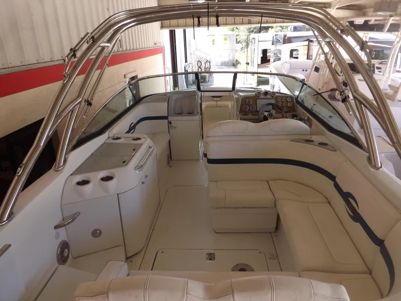 Slide: The Image of 2008 Formula 310 Bowrider interior with white seating and stainless steel accents. - 8