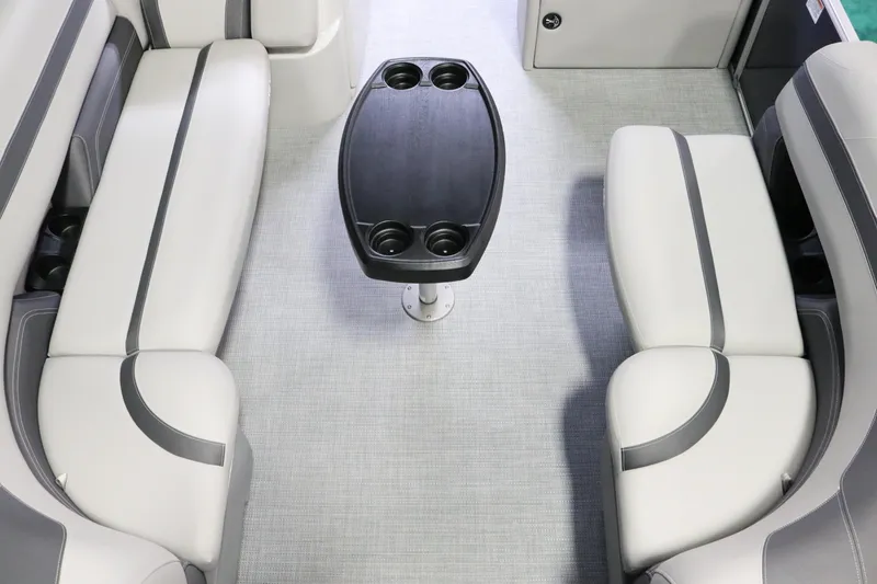 Slide: The Image of 2023 Sylvan L3 ENT boat interior with gray seating and central table. - 14