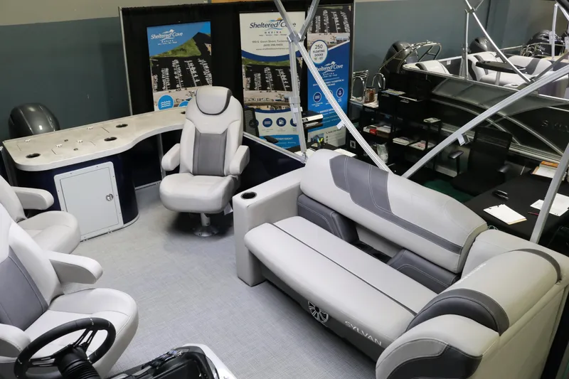 Slide: The Image of 2023 Sylvan L3 ENT boat interior with modern seating and control panel. - 17