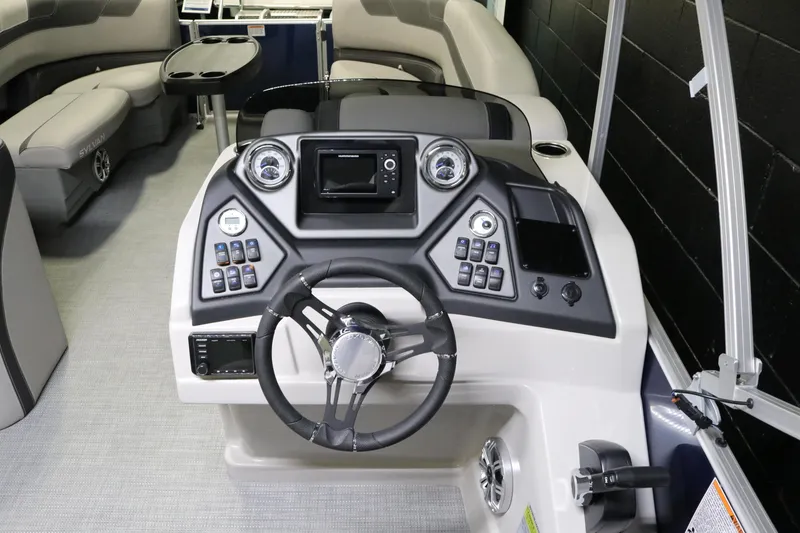 Slide: The Image of 2023 Sylvan L3 ENT boat dashboard with steering wheel and control panel. - 20