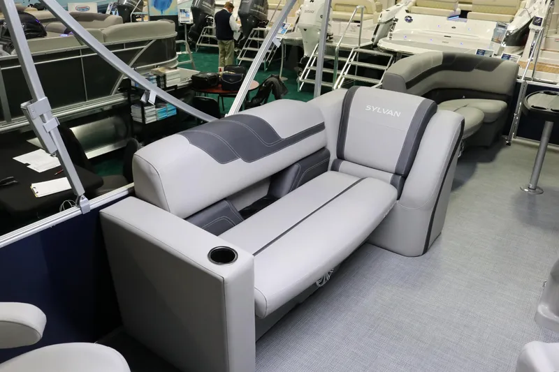 Slide: The Image of 2023 Sylvan L3 ENT pontoon boat interior with gray seating and cup holder. - 21