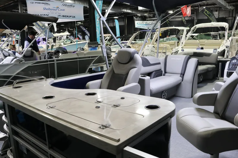 Slide: The Image of 2023 Sylvan L3 ENT pontoon boat interior with luxurious seating and modern amenities. - 25