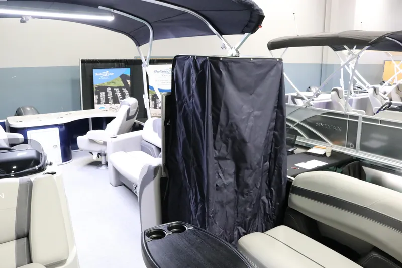 Slide: The Image of 2023 Sylvan L3 ENT pontoon boat interior with seating and canopy. - 28