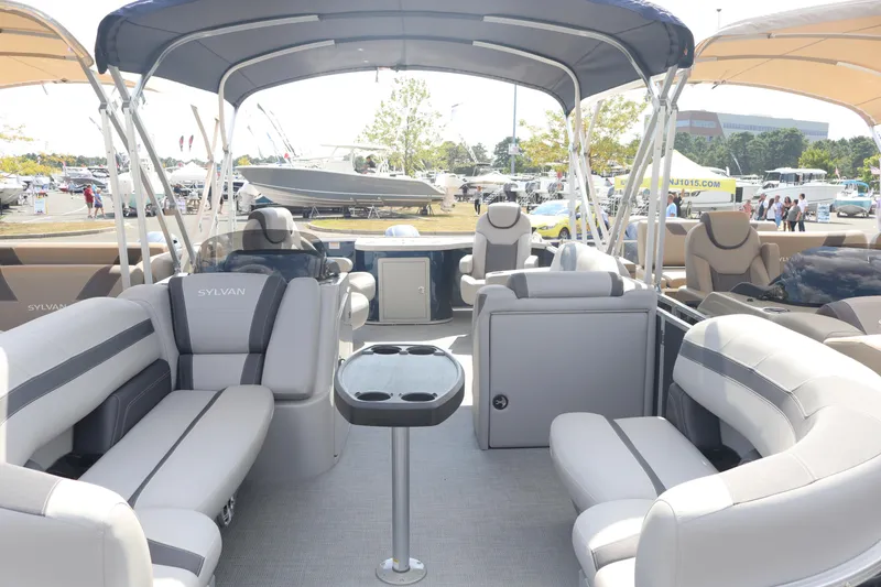 Slide: The Image of 2023 Sylvan L3 ENT pontoon boat interior with luxurious seating and modern design. - 4