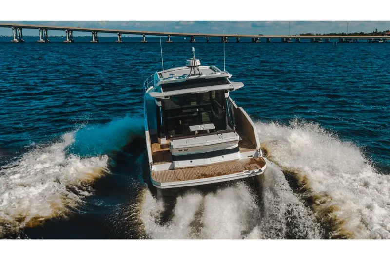 Slide: The Image of 2023 Galeon 410 HTC yacht cruising on open water. - 10