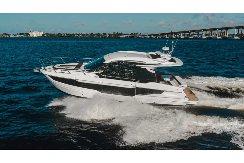 Slide: The Image of 2023 Galeon 410 HTC yacht cruising on open water. - 11