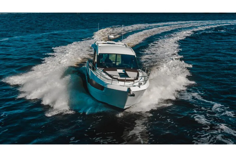 Slide: The Image of 2023 Galeon 410 HTC yacht cruising on open water. - 13