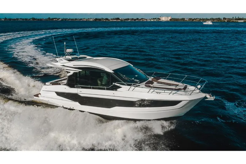 Slide: The Image of 2023 Galeon 410 HTC yacht cruising on open water. - 15