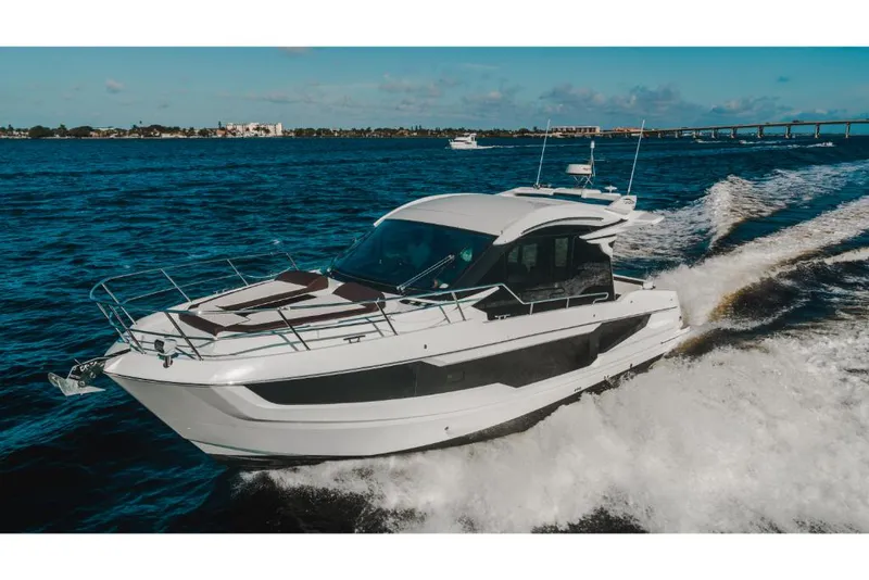 Slide: The Image of 2023 Galeon 410 HTC yacht cruising on open water. - 20