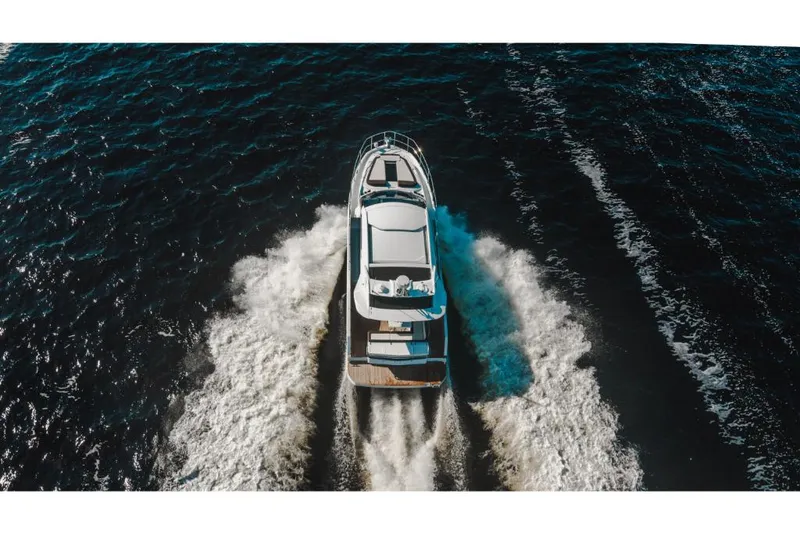 Slide: The Image of Aerial view of 2023 Galeon 410 HTC yacht cruising on open water. - 21