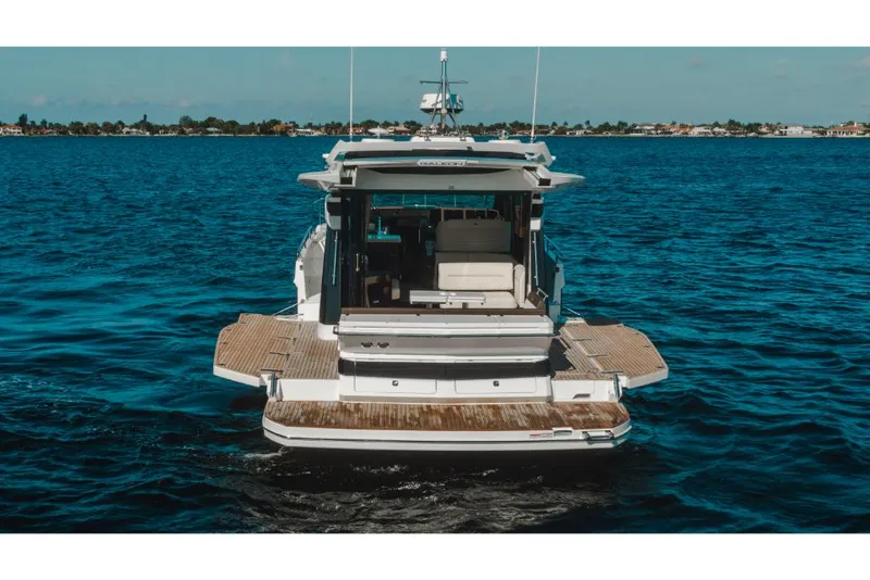 Slide: The Image of 2023 Galeon 410 HTC yacht on open water, rear view. - 24
