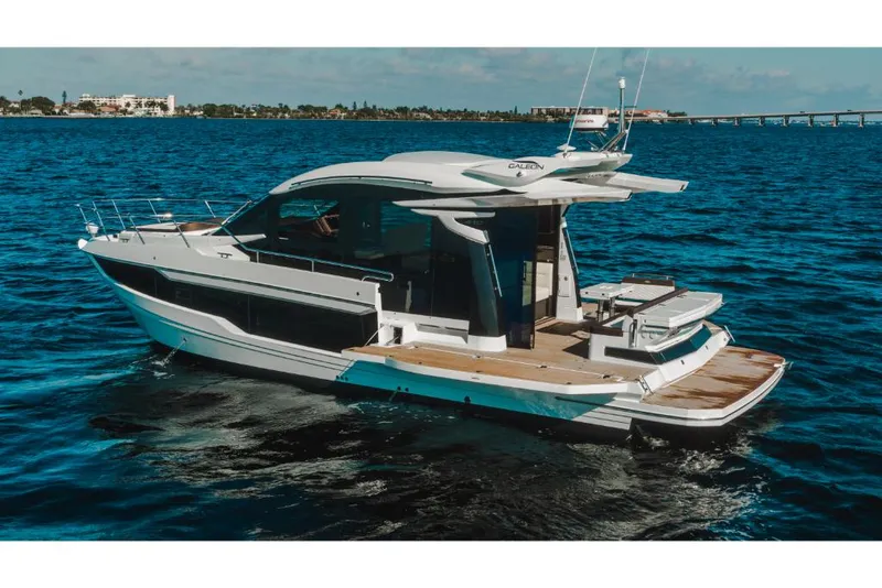 Slide: The Image of 2023 Galeon 410 HTC luxury yacht cruising on open water. - 30
