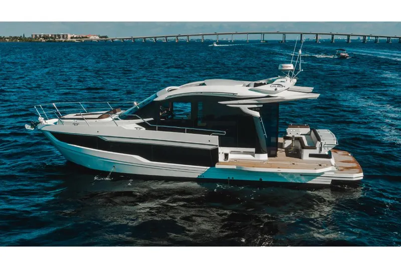 Slide: The Image of 2023 Galeon 410 HTC luxury yacht cruising on open water. - 31
