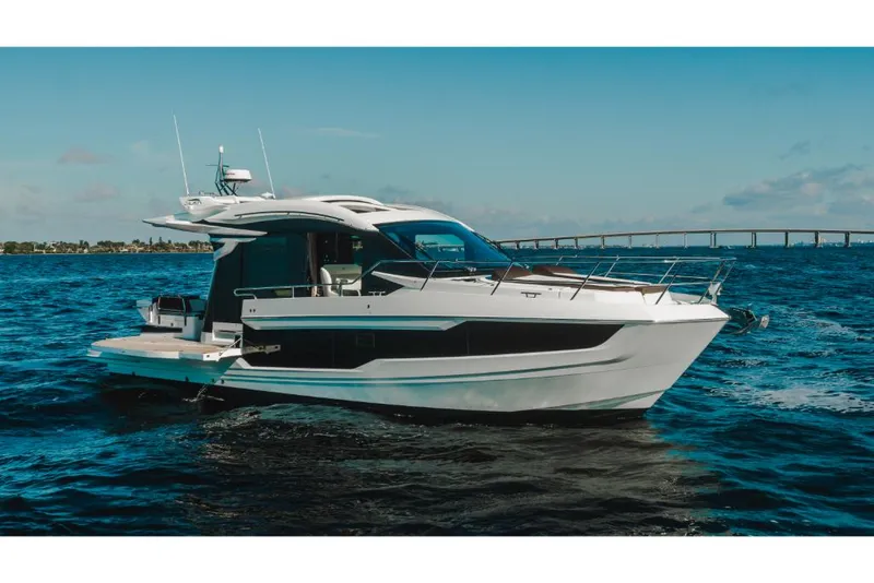 Slide: The Image of 2023 Galeon 410 HTC yacht cruising on open water. - 33