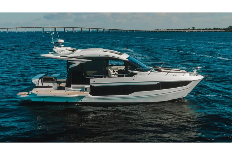 Slide: The Image of 2023 Galeon 410 HTC luxury yacht cruising on open water. - 34