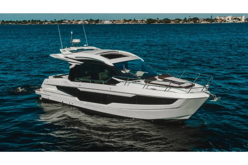 Slide: The Image of 2023 Galeon 410 HTC luxury yacht cruising on open water. - 36