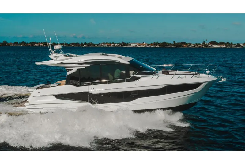 Slide: The Image of 2023 Galeon 410 HTC yacht cruising on open water. - 37