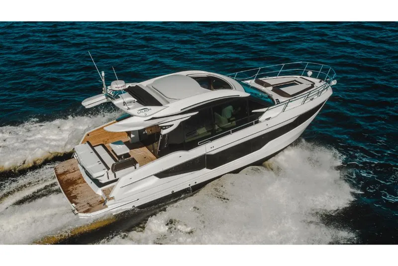 Slide: The Image of 2023 Galeon 410 HTC luxury yacht cruising on open water. - 38