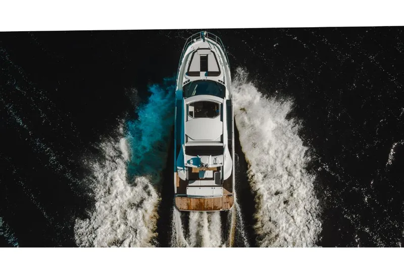 Slide: The Image of Aerial view of 2023 Galeon 410 HTC yacht cruising on water. - 39
