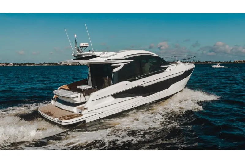 Slide: The Image of 2023 Galeon 410 HTC luxury yacht cruising on open water. - 4