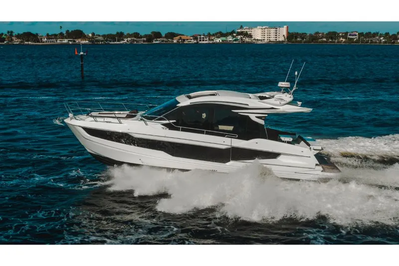 Slide: The Image of 2023 Galeon 410 HTC yacht cruising on open water. - 42