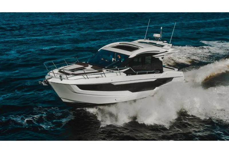 Slide: The Image of 2023 Galeon 410 HTC luxury yacht cruising on open water. - 43