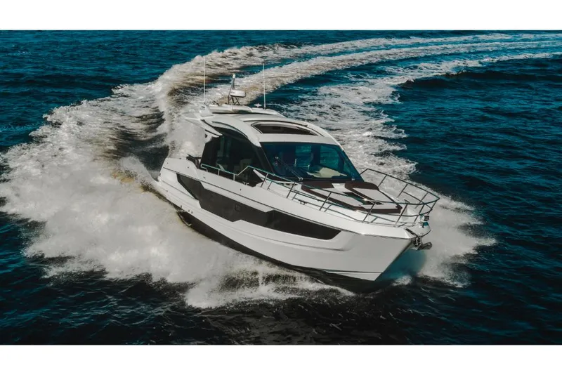 Slide: The Image of 2023 Galeon 410 HTC yacht cruising on open water. - 44