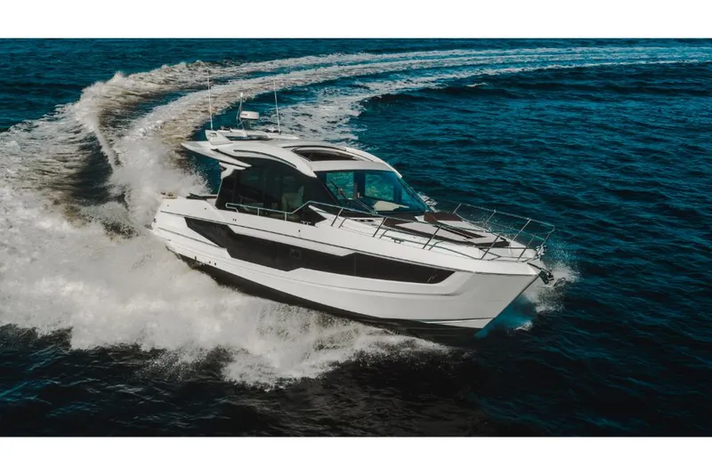 Slide: The Image of 2023 Galeon 410 HTC yacht cruising on open water. - 45