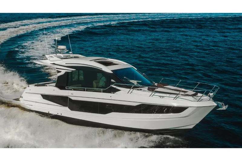 Slide: The Image of 2023 Galeon 410 HTC luxury yacht cruising on open water. - 46