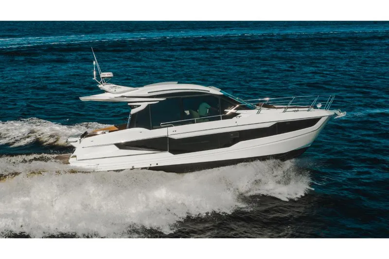 Slide: The Image of 2023 Galeon 410 HTC luxury yacht cruising on open water. - 47