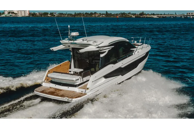 Slide: The Image of 2023 Galeon 410 HTC luxury yacht cruising on open water. - 48