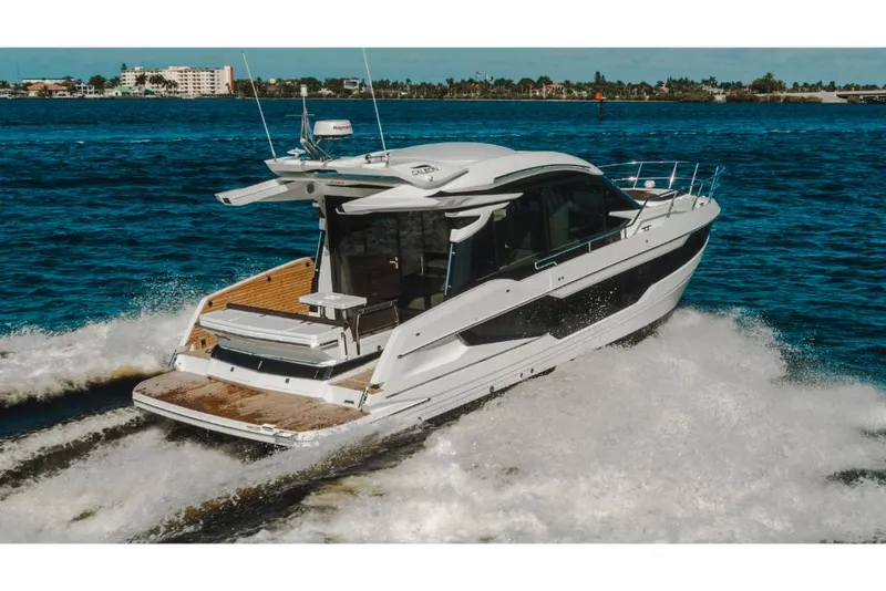 Slide: The Image of 2023 Galeon 410 HTC luxury yacht cruising on open water. - 49