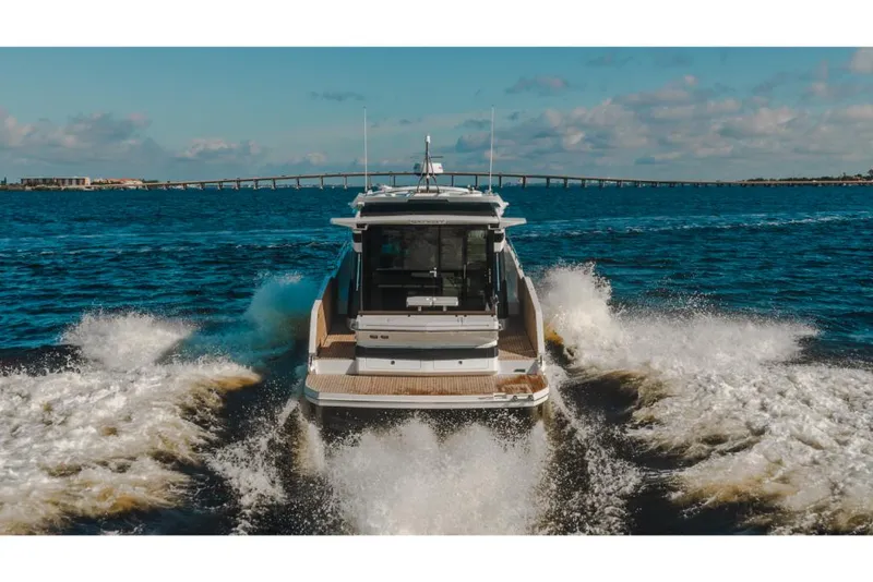 Slide: The Image of 2023 Galeon 410 HTC yacht cruising on open water. - 5