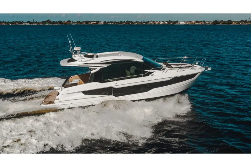 Slide: The Image of 2023 Galeon 410 HTC yacht cruising on open water. - 7
