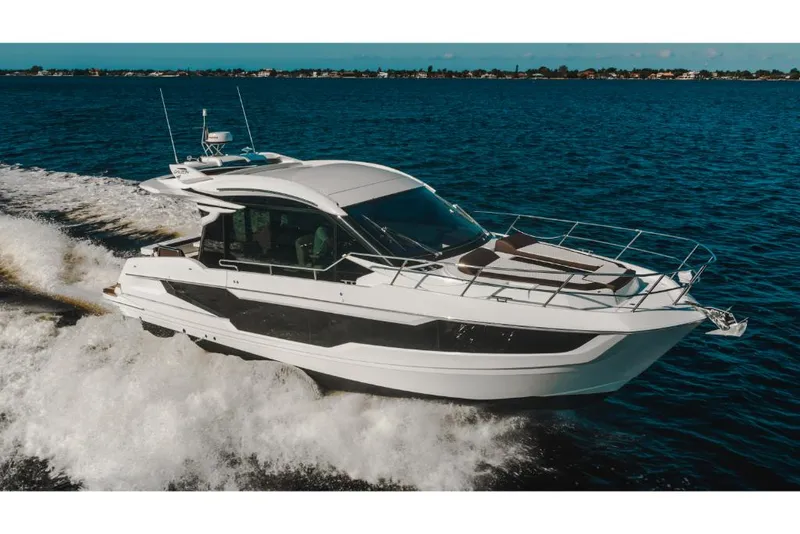 Slide: The Image of 2023 Galeon 410 HTC yacht cruising on open water. - 8