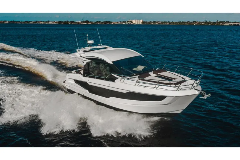 Slide: The Image of 2023 Galeon 410 HTC yacht cruising on open water. - 9