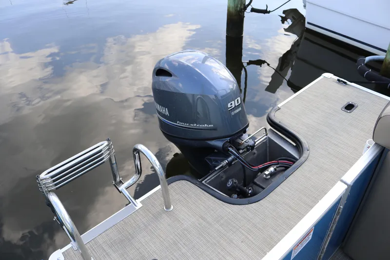 Slide: The Image of 2023 Sylvan Mirage 8520 Cruise with Yamaha 90 outboard motor on calm water. - 15