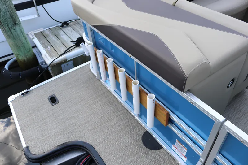 Slide: The Image of 2023 Sylvan Mirage 8520 Cruise boat with rod holders and seating area. - 16