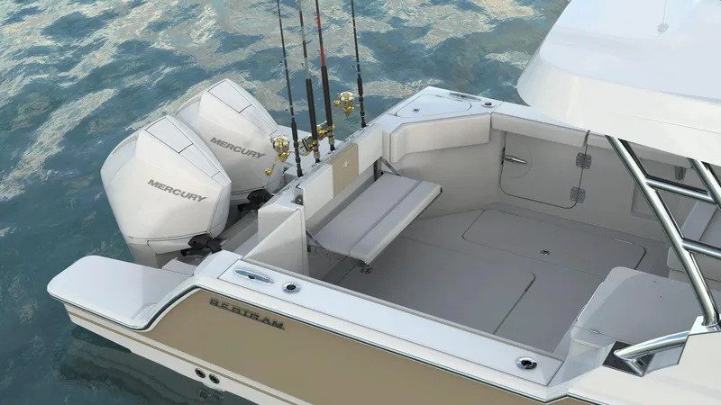 Slide: The Image of 2023 Bertram 28XC boat with twin Mercury outboard engines on water. - 5
