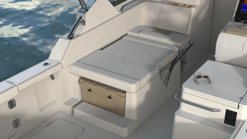 Slide: The Image of 2023 Bertram 28XC boat interior with cushioned seating and storage. - 6