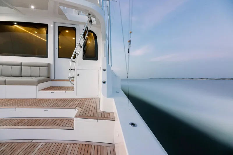 Slide: The Image of 2023 Bertram 61 Convertible yacht with teak deck and luxurious seating. - 13