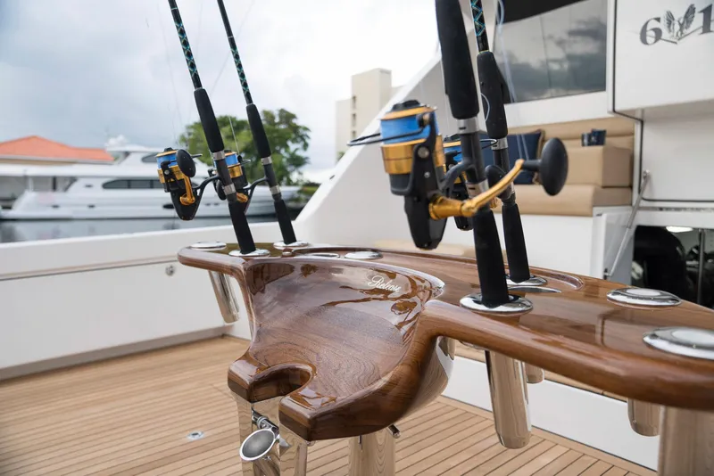 Slide: The Image of Fishing rods on a 2023 Bertram 61 Convertible yacht's deck. - 17