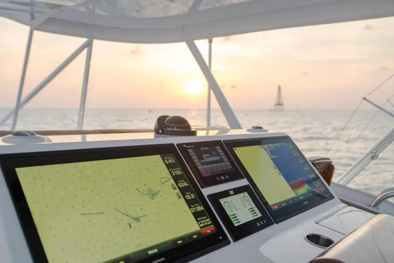 Slide: The Image of 2023 Bertram 61 Convertible yacht navigation system at sunset - 19