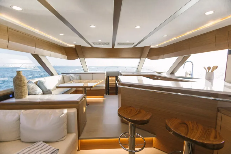 Slide: The Image of Luxurious interior of 2023 Bertram 61 Convertible yacht with modern furnishings and ocean view. - 23