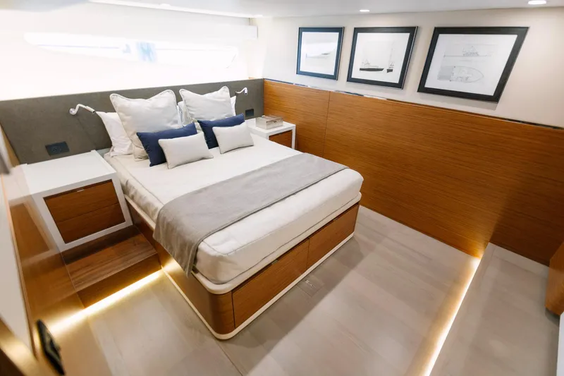 Slide: The Image of Luxurious bedroom interior of 2023 Bertram 61 Convertible yacht with modern decor. - 27