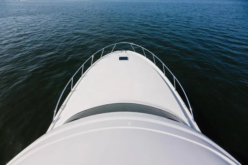 Slide: The Image of Aerial view of 2023 Bertram 61 Convertible yacht on open water. - 7