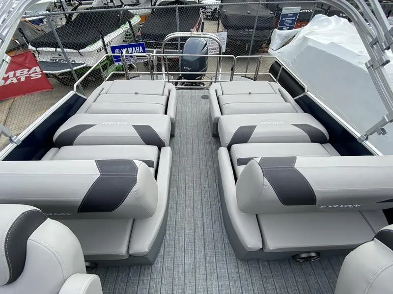 Slide: The Image of 2023 Sylvan L3 RLZ pontoon boat with spacious seating and modern design. - 2