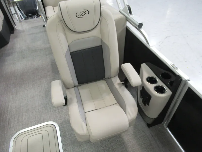 Slide: The Image of 2023 Sylvan L3 RLZ boat seat with cup holders, featuring beige and gray upholstery. - 5