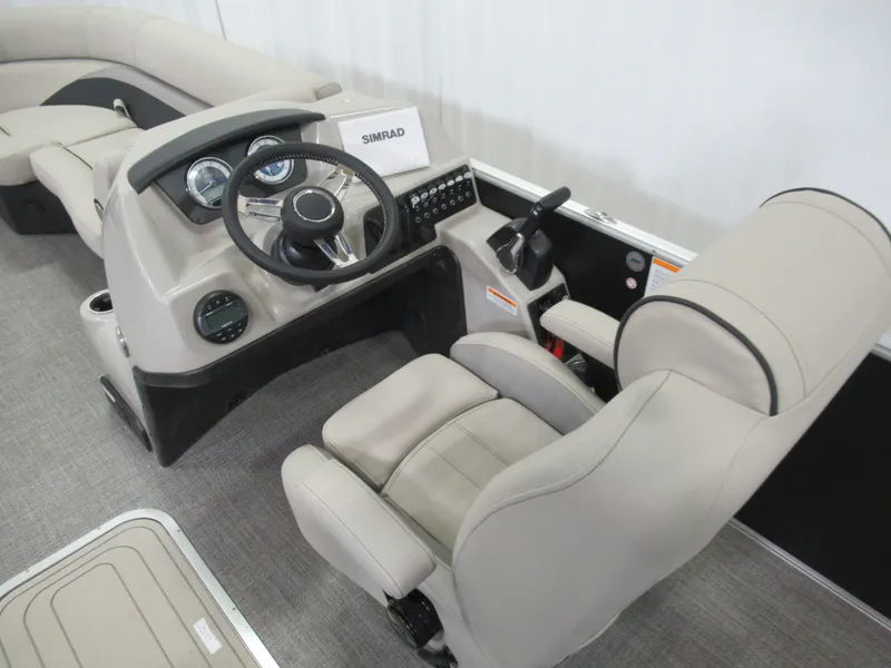 Slide: The Image of 2023 Sylvan L3 RLZ boat interior with steering console and comfortable seating. - 7